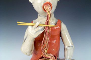 Ceramic man eating noodles